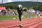 alien athlete running 100-meter dash, with the finish line in sight
