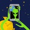 Alien makes selfie in space. Space alien takes pictures of herse