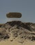 Alien Mother Ship Hovering Over the Mountains of a Desert Planet