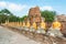 Aligned buddha statues with orange bands in Ayutthaya, Thailand