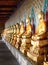 Aligned gold buddha in wat arun, Bangkok, ThaÃ¯land