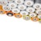 Alkaline batteries multi-colored metal and the positive side of the AA-size batteries isolated on white background closeup