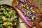 Alkaline, healthy food: salad with flowers, fruit and valerian salad