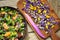 Alkaline, healthy food: salad with flowers, fruit and valerian salad