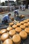 Alkmaar, Netherlands - July 20, 2018: Men are loading cheeses on