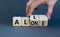 All or alone and support symbol. Businessman turns the wooden cube and changes the word alone to all. Beautiful grey background.