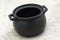 An all black clay porcelain cooking pot with two side handles