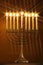 All candle lite on the traditional Hanukkah menorah with star filter