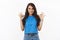 All good, nothing worry about. Optimistic, encouraging cute brunette female in blue t-shirt, showing okay gesture