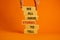 We all have stories to tell symbol. Wooden blocks with words `We all have stories to tell`. Businessman hand. Beautiful orange