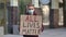 ALL LIVES MATTER concept, no racism. Outdoors portrait of a young male activist wearing a medical mask holding a