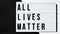 ALL LIVES MATTER text on a black and white background. Freedom of Speech Vintage Retro quote board. Protest against the end of