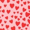 All over seamless vector repeat pattern with flying red hearts on pink background