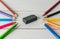 All pencil colorful sharpener and eraser on blurred wooden table