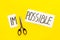 All is possible concept. Cut word impossible near scissors on yellow background