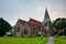 All Saints church in Herstmonceux, East Sussex, England. Brick Herstmonceux castle in England East Sussex 15th century. Birds of