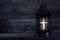 All Saints Day. Votive candle on dark background