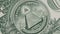 The All-Seeing Eye Sign Rotates on a One Dollar Bill Close-Up