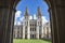 All Souls college, Oxford university - front view of entrance with towers and the green lawn from an archway