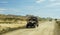 All-terrain vehicle circulating at speed in the desert of the Bardenas