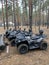 All-terrain vehicles for driving through the forest. Quad bike on the background of the forest. Four-wheeled vehicles for outdoor