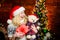All she wants for christmas. Cheerful woman. Woman got teddy bear toy present. Santa hat christmas accessory. Cute gift