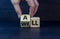 All is well symbol. Businessman turns cubes with words all well. Beautiful grey table, grey background, copy space. Business,