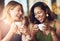 All you need is coffee and good company. Cropped shot of girlfriends enjoying their coffee at a cafe.