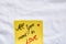 All you need is love handwriting text close up isolated on yellow paper with copy space