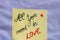 All you need is love handwriting text close up isolated on yellow paper with copy space
