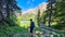 Allakogel - Hiker woman with backpack with scenic view of alpine lake Sackwiesensee in Hochschwab mountain