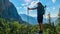 Allakogel - Hiker woman on hiking trail in dense alpine forest with scenic view of majestic mountains of Hochschwab