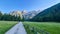 Allakogel - Hiking trail along alpine meadow with scenic view of majestic mountains of Hochschwab Region,