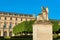 Allegory statue of Victorious France and Louvre museum.