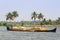 Allepey, Kerala, India â€“ March 31, 2015: Indian man transport dwell with rice for boats. backwaters canoe in state