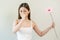 Allergic rhinitis symptom of odor pollen flowering, portrait asian young woman hand in sneeze, blowing runny nose after smell,