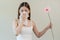 Allergic rhinitis symptom of odor pollen flowering, portrait asian young woman hand in sneeze, blowing runny nose after smell,