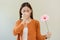 Allergic rhinitis symptom of odor pollen flowering, portrait asian young woman hand in sneeze, blowing runny nose after smell,