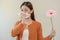 Allergic rhinitis symptom of odor pollen flowering, portrait asian young woman hand in sneeze, blowing runny nose after smell,