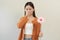 Allergic rhinitis symptom of odor pollen flowering, portrait asian young woman hand in sneeze, blowing runny nose after smell,