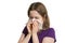 Allergy concept. Young allergic woman is sneezing and blowing her nose