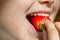 Allergy food strawberry and abstract allergic reaction on the girl\'s face