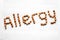 Allergy written with peanuts. Word and text made from nuts.