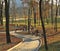 Alley in with empty benches in autumn park