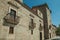 Alley and gothic building with balconies at Avila