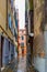 Alley between gothic style buildings on brick/cobblestone street in Venice, Italy