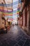 Alley in the historic center of Martina Franca with colored awnings