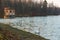 Alley on the lake, old observation deck on the pond, observation gazebo on the lake