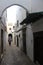 Alley in the medina in Tetouan, city in Morocco / North Africa, building by sunset