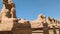 Alley of sheep-headed sphinxes in front of the temple of Karnak in Egypt.
